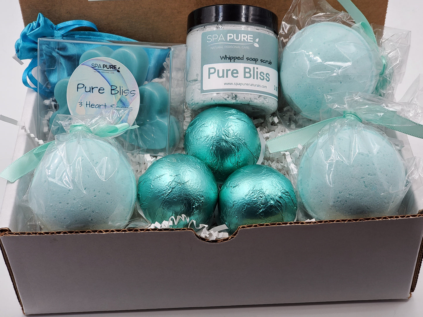 Spa Pure Luxury Spa Kit - Pure Bliss - 3 XL Pure Bliss Bath Fizzies, 3 Pure Bliss shower steamers, 3 Heart-shaped soaps, one 3.5 oz Pure Bliss whipped soap scrub, 1 Roll-on Perfume, Perfect for a mini-spa treatment.